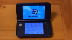  Look at this terribly cursed setup: Windows 95 running on a Nintendo 3DS hacked